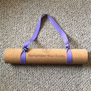 Gurus Roots professional cork yoga mat with carrying strap.